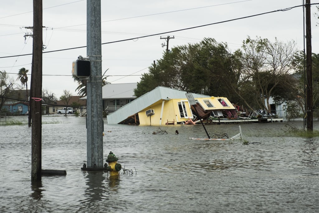 Flooding and a damaged home are seen after Hurricane Harvey hit Rockport, Texas, U.S., on Saturday, Aug. 26, 2017. As Harvey's winds die down, trouble for Texas has just begun as days of flooding rains across the heart of U.S. energy production threaten the country's fourth-largest city and leave farmers struggling to save horses, cows and crops. Photographer: Alex Scott/Bloomberg via Getty Images