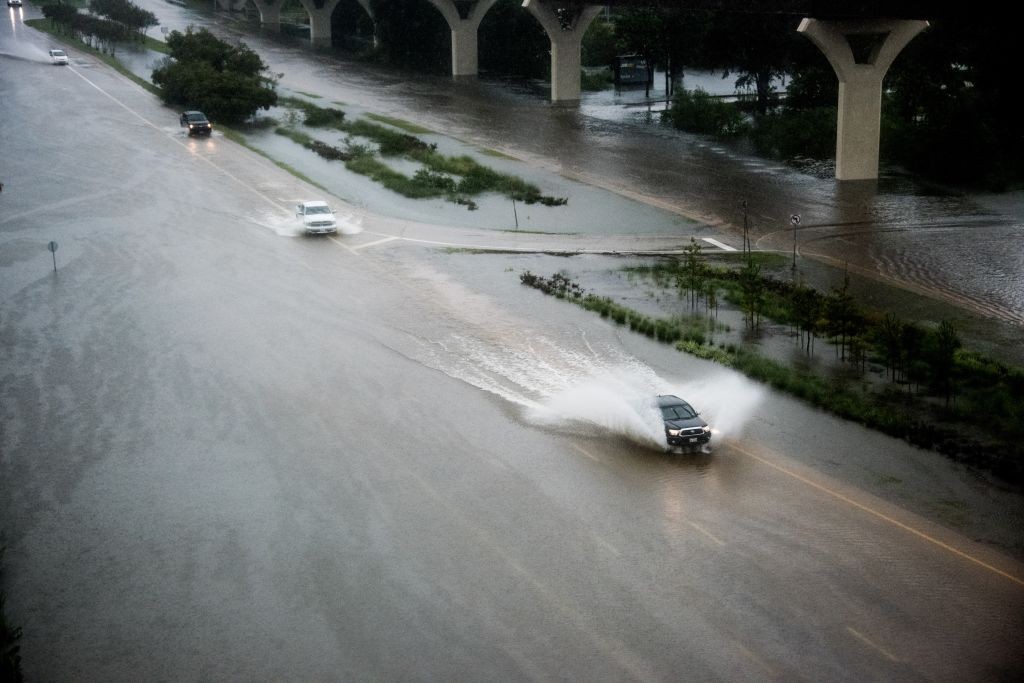 WOODLANDS, USA - AUGUST 27: Cars pass through a flooded highway during Hurricane Harvey in Woodlands, TX, United States on August 27, 2017. (Photo by Tharindu Nallaperuma/Anadolu Agency/Getty Images)