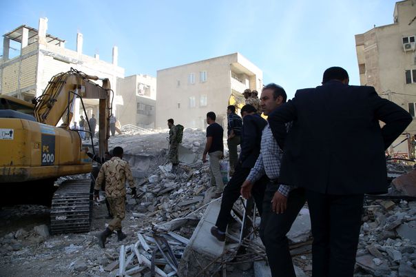 KERMANSHAH, IRAN - NOVEMBER 13: Military search and rescue teams continue rescue works near a partially collapsed building in Sarpol-e Zahab town of Kermanshah, Iran on November 13, 2017 following a 7.3 magnitude earthquake that hit the Iraq and Iran. An earthquake measuring 7.3 on the Richter scale rocked northern Iraq and Iran, the U.S. Geological Survey said on Sunday evening. Turkish paramedic teams and rescue teams dispatched to the disaster area under the coordination of Turkish aid agencies; AFAD (Turkey's Disaster Management Agency) and Kizilay (Turkish Red Crescent). At least 211 died and 2,504 others were injured in Iran's bordering regions, especially in Kermanshah province in west. Fatemeh Bahrami / Anadolu Agency