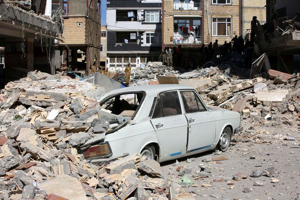KERMANSHAH, IRAN - NOVEMBER 13: A car is trapped under the rubble in Sarpol-e Zahab town of Kermanshah, Iran on November 13, 2017 following a 7.3 magnitude earthquake that hit the Iraq and Iran. An earthquake measuring 7.3 on the Richter scale rocked northern Iraq and Iran, the U.S. Geological Survey said on Sunday evening. Turkish paramedic teams and rescue teams dispatched to the disaster area under the coordination of Turkish aid agencies; AFAD (Turkey's Disaster Management Agency) and Kizilay (Turkish Red Crescent). At least 211 died and 2,504 others were injured in Iran's bordering regions, especially in Kermanshah province in west. Fatemeh Bahrami / Anadolu Agency