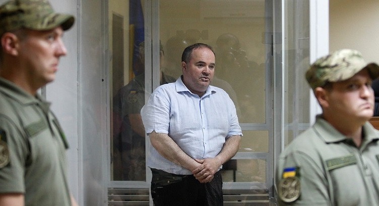 epa06776645 Boris German (C) attends a court hearing about a preventive punishment for him at the Svyatoshynskiy district court in Kiev, Ukraine, 31 May 2018. Ukrainian media reported that the court has ruled to arrest Boris German for 60 days without bail, on charges of an assassination attempt on Russian journalist Arkady Babchenko. German reportedly is the Executive Director of the Ukrainian-German arms manufacturer JV Schmeisser, the only non-state enterprise licensed to manufacture weapons in Ukraine. Ukrainian law enforcement agents on 29 May prevented the assassination of Babchenko in Kiev by staging the fake killing. According to the SBU Security Service of Ukraine, Russia's special service hired a Ukrainian citizen who allegedly received 40,000 US dollars, including 30,000 US dollars to hire a hitman. German was detained on 30 May 2018.  EPA-EFE/STEPAN FRANKO