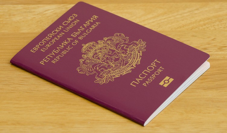Bulgarian biometric passport on wooden table