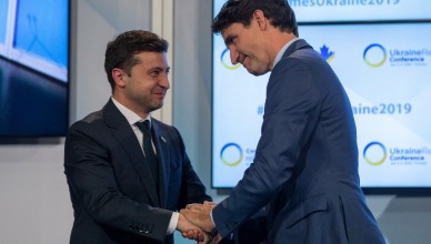 Canadian Prime Minister Justin Trudeau (R) and Ukrainian President Volodymyr Zelensky embrace after Trudeau's address to the Ukrainian Reform conference in Toronto, Ontario, on July 2, 2019. (Photo by Lars Hagberg / AFP)