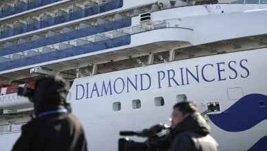 The quarantined cruise ship Diamond Princess is anchored in the Yokohama Port Sunday, Feb. 9, 2020. Japan on Saturday reported three more cases of the coronavirus aboard the Diamond Princess for a total of 64 . There are 3,700 passengers and crew on the Diamond Princess who must remain on board for 14 days. (AP Photo/Eugene Hoshiko)