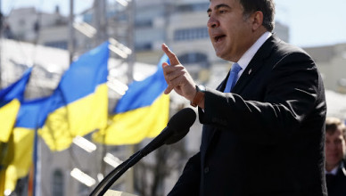 Former Georgian president Mikhail Saakashvili addresses members of a Batkivshchyna party during a meeting in central Kiev, March 29, 2014. Ukrainian former prime minister Yulia Tymoshenko, released from jail last month after her arch-foe Viktor Yanukovich fled from power, was nominated as presidential candidate at the Batkivshchyna party meeting for the election on May 25.  REUTERS/Gleb Garanich  (UKRAINE - Tags: POLITICS ELECTIONS) - RTR3J3K4