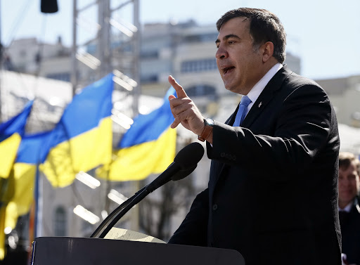 Former Georgian president Mikhail Saakashvili addresses members of a Batkivshchyna party during a meeting in central Kiev, March 29, 2014. Ukrainian former prime minister Yulia Tymoshenko, released from jail last month after her arch-foe Viktor Yanukovich fled from power, was nominated as presidential candidate at the Batkivshchyna party meeting for the election on May 25.  REUTERS/Gleb Garanich  (UKRAINE - Tags: POLITICS ELECTIONS) - RTR3J3K4