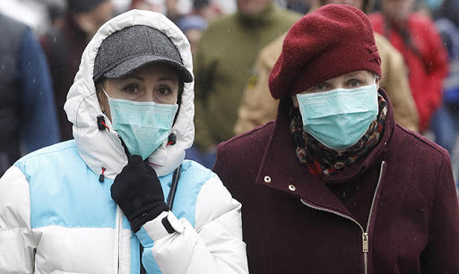 KIEV, UKRAINE - 2020/03/14: People wearing protective masks as a preventive measure against coronavirus COVID-19 during the quarantine.Ukraine introduced a three-week quarantine to counter the new coronavirus COVID-19, due to the worldwide ovid-19 coronavirus epidemic. This involves closure of educational institutions, ban on mass gatherings of more than 200 people, the closure of air services with some countries and closed international regular passenger traffic. (Photo by Pavlo Gonchar/SOPA Images/LightRocket via Getty Images)