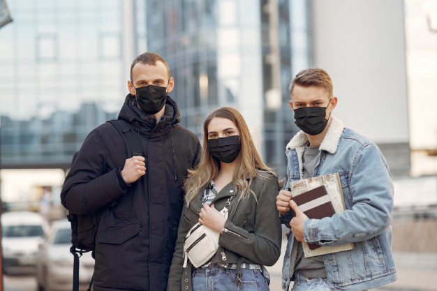 people-in-a-masks-stands-on-the-street_1157-31590