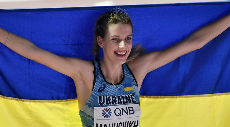 Yaroslava Mahuchikh, of Ukraine, celebrates after winning the silver medal in the women's high jump final during the World Athletics Championships in Doha, Qatar, Monday, Sept. 30, 2019. (AP Photo/Martin Meissner)