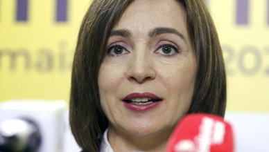 Former prime minister Maia Sandu speaks to media at her campaign headquarters in Chisinau, Moldova, Monday, Nov. 16, 2020. Maia Sandu, a former World Bank economist who favors closer ties with the European Union, has won Moldova's presidential runoff vote, decisively defeating the staunchly pro-Russian incumbent, according to preliminary results released Monday. (AP Photo/Roveliu Buga)