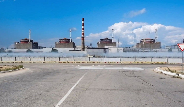 In this handout photo taken from video and released by Russian Defense Ministry Press Service on Sunday, Aug. 7, 2022, a general view of the Zaporizhzhia Nuclear Power Station in territory under Russian military control, southeastern Ukraine. The Russian military said that Ukrainian shelling of the Zaporizhzhia nuclear plant on Sunday caused a power surge and fire and forced staff to lower output from two reactors. (Russian Defense Ministry Press Service via AP)