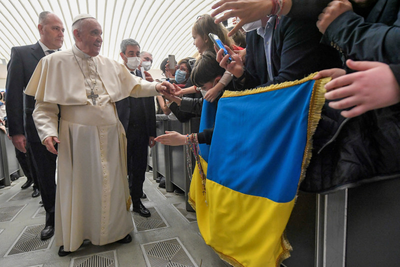 Pope Francis greets people who hold Ukrainian flag, amid ongoing Russia's invasion of Ukraine, at the weekly general audience at the Paul VI Hall at the Vatican, March 16, 2022. Vatican Media/Handout via REUTERS ATTENTION EDITORS - THIS IMAGE WAS PROVIDED BY A THIRD PARTY.