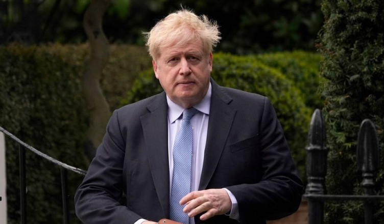 FILE - Boris Johnson leaves his house in London, on March 22, 2023. A U.K. court on Thursday, July 6, 2023, rejected the British government's request to keep former Prime Minister Boris Johnson's unredacted WhatsApp messages and diaries from being made public at an official COVID-19 inquiry. (AP Photo/Alberto Pezzali, File)