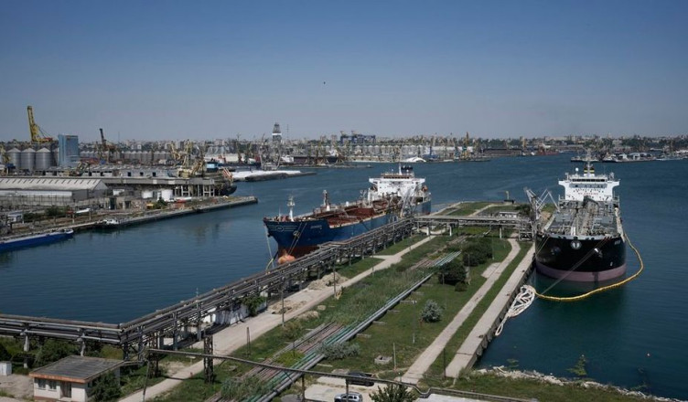 FILE - Ships are docked in the Black Sea port of Constanta, Romania, Tuesday, June 21, 2022. Neighbors Romania, Ukraine, and Moldova signed joint agreements on Thursday, April 13, 2023, in Romania's capital after a trilateral security meeting that focussed on ways to strengthen security in their Black Sea region to counter threats posed by Russian aggression. (AP Photo/Vadim Ghirda, File)