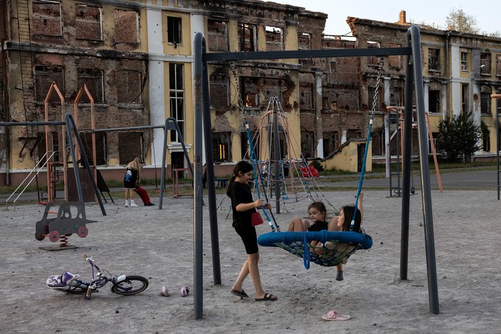 KHARKIV, UKRAINE - SEPTEMBER 4: Children at play in the playground in the yard of School Number 134 in Kharkiv, Ukraine on September 4, 2023. The was destroyed during a battle between Russian and Ukrainian forces on February 27, 2022.  (Photo by Heidi Levine for The Washington Post via Getty Images)