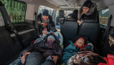 DONETSK OBLAST, UKRAINE - JANUARY 09: A worker of the Ukrainian NGO Charity Foundation 'East SOS' helps elderly people who requested to be evacuated from their home near the front line to a safer place in Toretsk, Donetsk Oblast, Ukraine on January 09, 2024. The villages surrounding the city of Kramatorsk and near the Bakhmut region are under constant threat of Russian strikes. (Photo by Ignacio Marin/Anadolu via Getty Images)