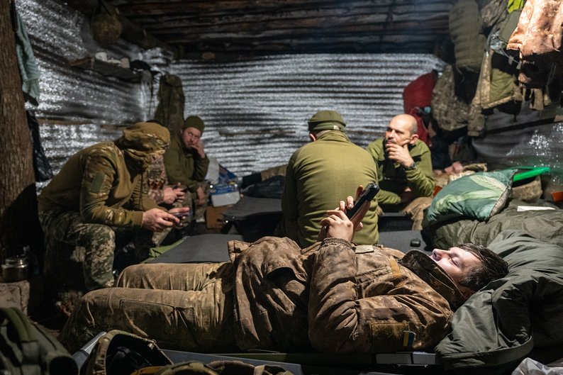 DONETSK OBLAST, UKRAINE - JANUARY 10: Ukrainian soldiers await orders inside a bunker on the Bakhmut frontline, in Donetsk Oblast, Ukraine on January 10, 2024. Despite the shortage of shells and ammunition, Ukrainian artillery units keep trying to repel Russian advances at the frontline near Bakhmut. The recent blizzard and harsh winter conditions only make the situation harder. (Photo by Ignacio Marin/Anadolu via Getty Images)