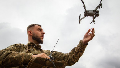 ZHYTOMYR REGION, UKRAINE - SEPTEMBER 20, 2023 - A serviceman launches a drone during a press tour to demonstrate the integration of AI into the process of humanitarian demining, Zhytomyr Region, northern Ukraine.  (Photo credit should read Kirill Chubotin / Ukrinform/Future Publishing via Getty Images)