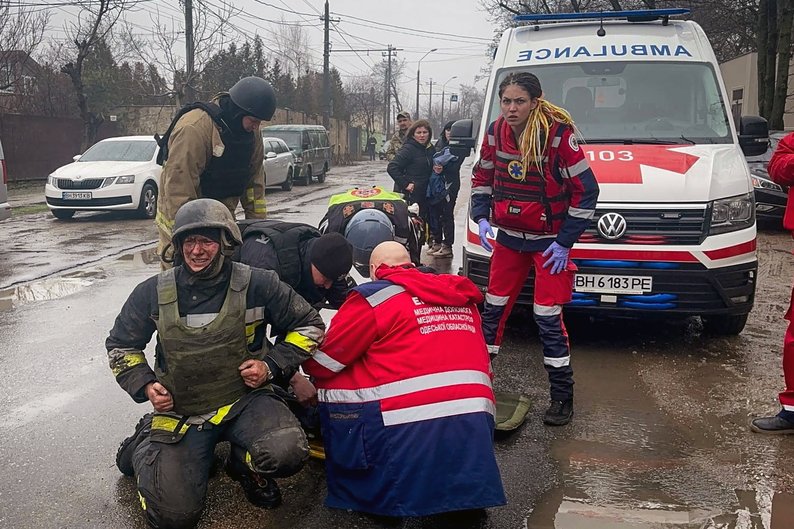 Paramedics help injured rescuers at the site of a Russian missile strike, amid Russia's attack on Ukraine, in Odesa, Ukraine March 15, 2024. Press service of the State Emergency Service of Ukraine in Odesa region/Handout via REUTERS ATTENTION EDITORS - THIS IMAGE HAS BEEN SUPPLIED BY A THIRD PARTY.
