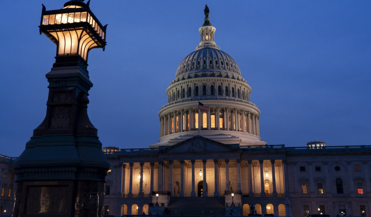 The U.S. Capitol in Washington is illuminated Friday evening, Feb. 9, 2024, as the Senate settles in for a rare weekend session to work on a package of wartime funding for Ukraine, Israel and other U.S. allies. (AP Photo/J. Scott Applewhite)