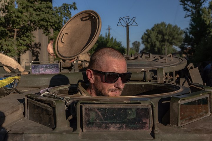 TOPSHOT - A Ukrainian soldier waits inside a US-made M113 armoured personnel carrier to depart for the front in an undisclosed area in the Donetsk region, on June 19, 2024, amid the Russian invasion of Ukraine. (Photo by Roman PILIPEY / AFP) (Photo by ROMAN PILIPEY/AFP via Getty Images)