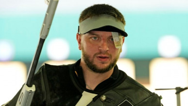 Ukraine's Serhiy Kulish competes in the 50m rifle 3 positions men's qualification round at the 2024 Summer Olympics, Wednesday, July 31, 2024, in Chateauroux, France. (AP Photo/Manish Swarup)