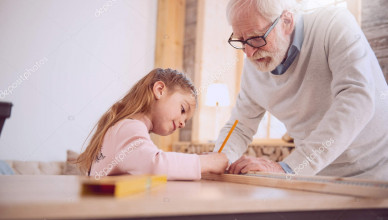 Young helper. Serious nice girl holding a pencil while making marks