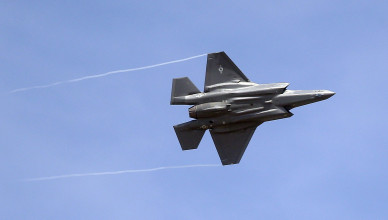 FILE - In this Wednesday, Sept. 2, 2015, file photo, an F-35 jet arrives at its new operational base at Hill Air Force Base, in northern Utah. Shares of Lockheed Martin fell Monday, Dec. 12, 2016, as President-elect Donald Trump tweeted that making F-35 fighter planes is too costly and that he will cut "billions" in costs for military purchases. (AP Photo/Rick Bowmer, File)