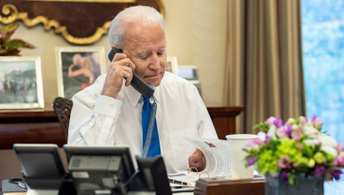 Reportage: President Joe Biden talks on the phone with January 6th heroes, Thursday, January 6, 2022, in the Oval Office Dining Room of the White House. (Photo by: HUM Images/Universal Images Group via Getty Images)