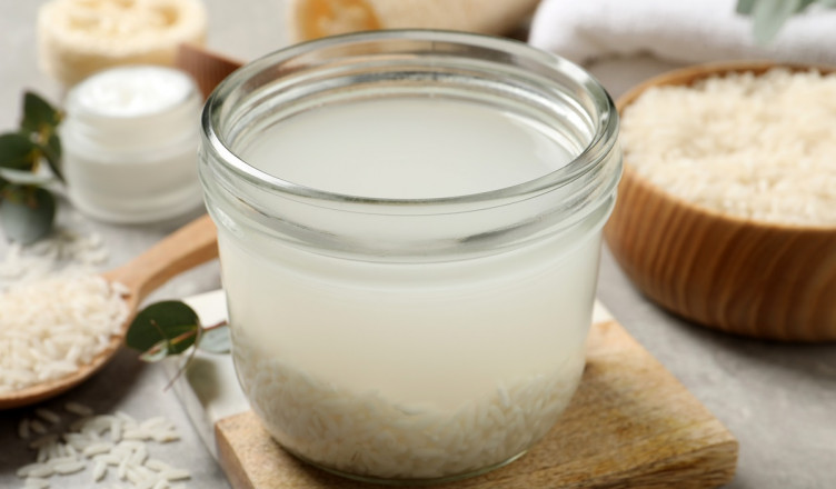 Glass,Jar,With,Rice,Soaked,In,Water,On,Light,Grey