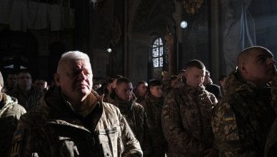 LVIV, UKRAINE - DECEMBER 6: Servicemen attend liturgy at the Saint Peter and Paul Garrison Church on the Day of Ukrainian Armed Forces on December 6, 2024 in Lviv, Ukraine. On this day in 1991, in the first year of Ukrainian independence, the Verkhovna Rada has adopted the Law ‘About the Armed Forces of Ukraine’; in 1993, this date has been declared a national holiday. (Photo by Les Kasyanov/Global Images Ukraine via Getty Images)