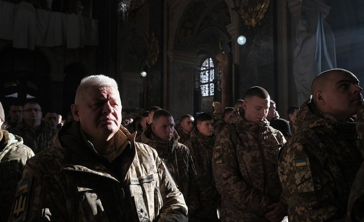 LVIV, UKRAINE - DECEMBER 6: Servicemen attend liturgy at the Saint Peter and Paul Garrison Church on the Day of Ukrainian Armed Forces on December 6, 2024 in Lviv, Ukraine. On this day in 1991, in the first year of Ukrainian independence, the Verkhovna Rada has adopted the Law ‘About the Armed Forces of Ukraine’; in 1993, this date has been declared a national holiday. (Photo by Les Kasyanov/Global Images Ukraine via Getty Images)