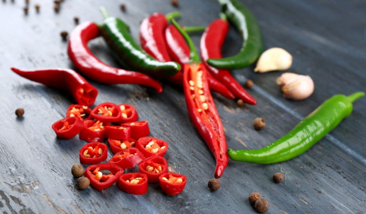 Hot,Peppers,With,Spices,On,Wooden,Table,Close,Up