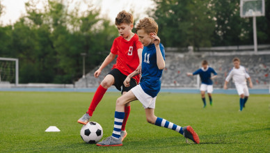 Boys,Playing,Football,Game,On,A,School,Tournament.,Football,Soccer