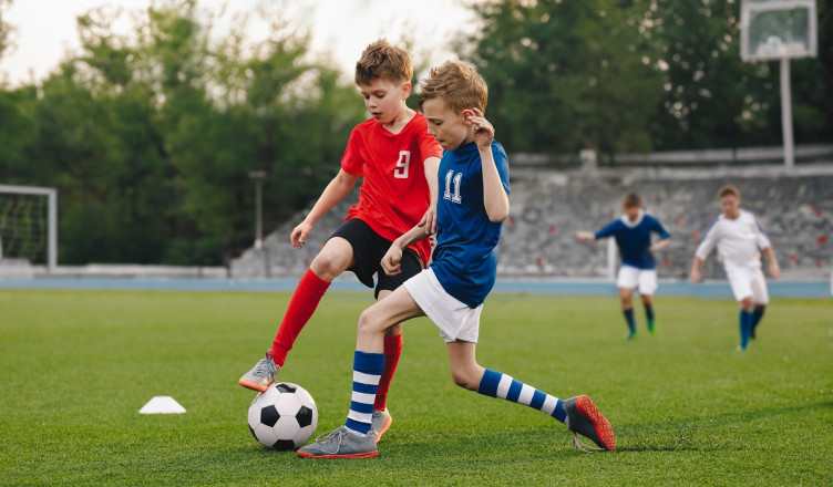 Boys,Playing,Football,Game,On,A,School,Tournament.,Football,Soccer