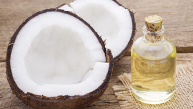 Fragments,Of,Coconut,On,Wooden,Background