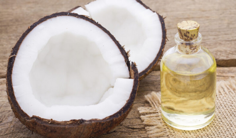 Fragments,Of,Coconut,On,Wooden,Background