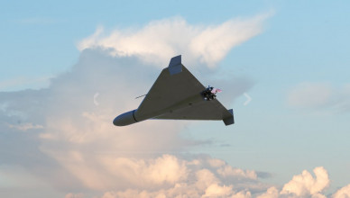 Russian army kamikaze combat drone in the sky against clouds, war in Ukraine, drone attack, 3d render.