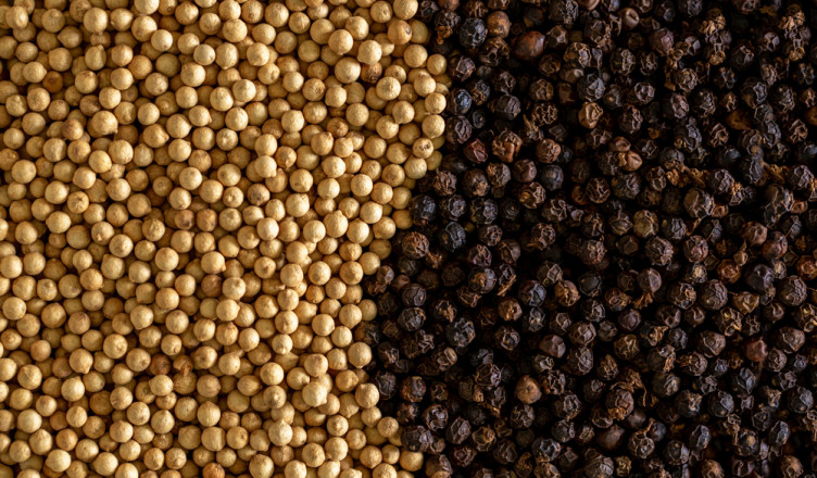 White,Pepper,And,Black,Pepper,Close-up,As,A,Background.,Spices